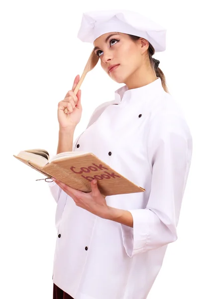 Portrait of young woman chef with cook book isolated on white — Stock Photo, Image