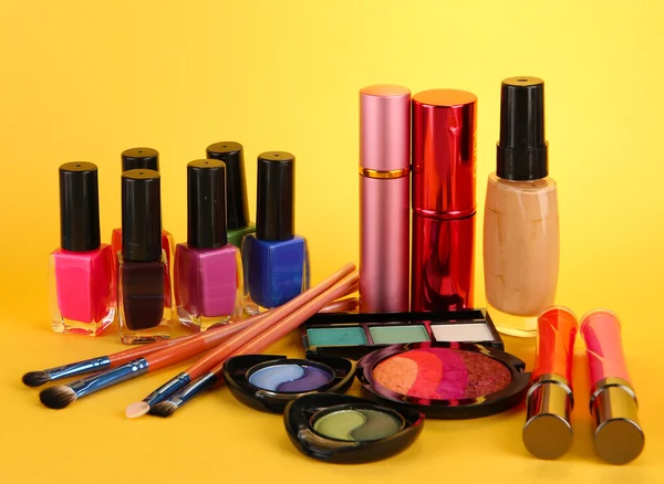 Cosmetics on yellow background — Stock Photo, Image