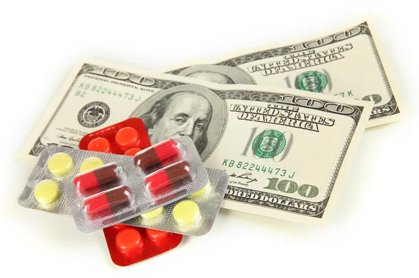 Pills and money isolated on white — Stock Photo, Image