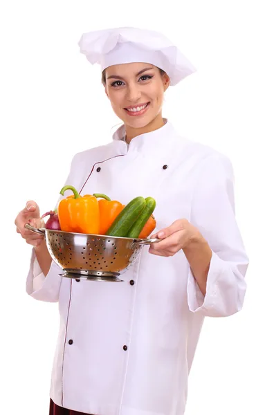 Retrato de jovem chef com legumes isolados em branco — Fotografia de Stock