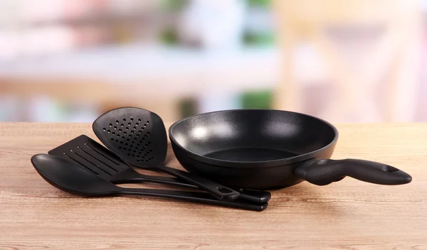 Kitchen tools on table in kitchen — Stock Photo, Image