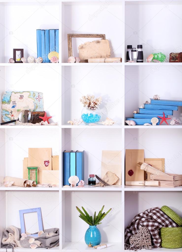 Beautiful white shelves with different travel related objects — Stock