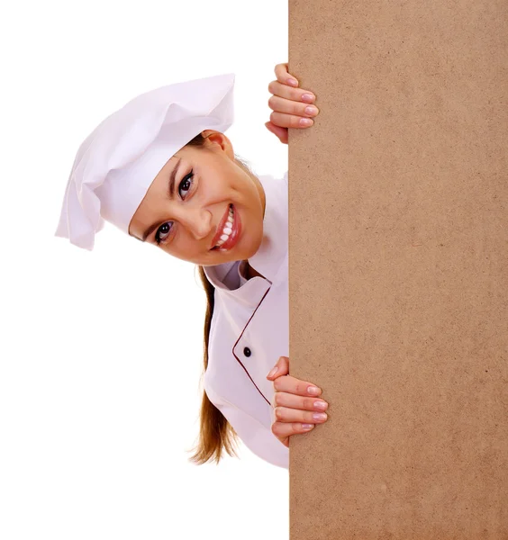 年轻女子厨师与空板隔离在白色的肖像 — 图库照片