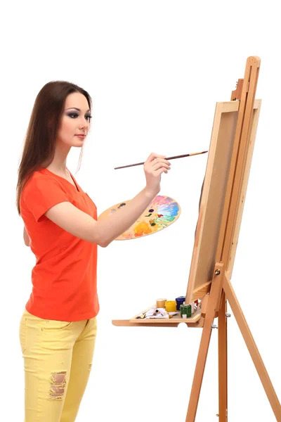 Güzel bir genç kadın ressam üzerine beyaz izole iş başında — Stok fotoğraf