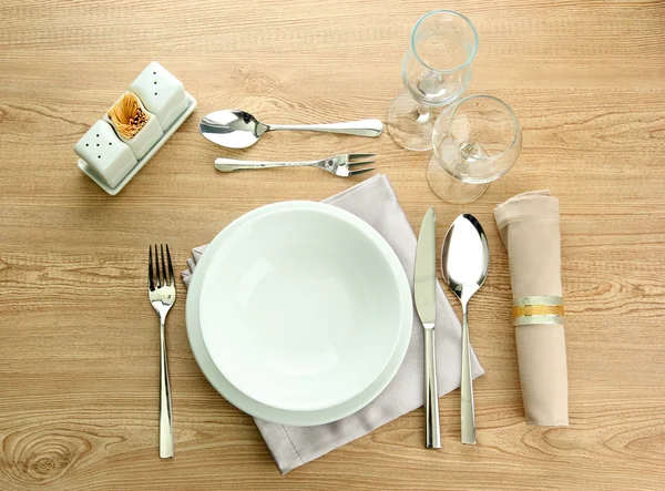 Table setting on wooden table — Stock Photo, Image