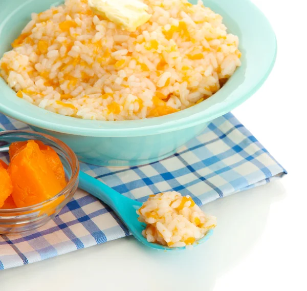 Pruebe la papilla de arroz con calabaza en un tazón azul, aislado en blanco —  Fotos de Stock