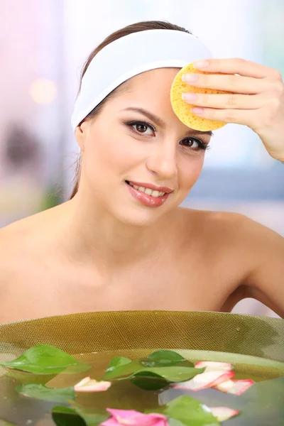 Young woman washing her face. Conceptual photo: make-up remover — Stock Photo, Image