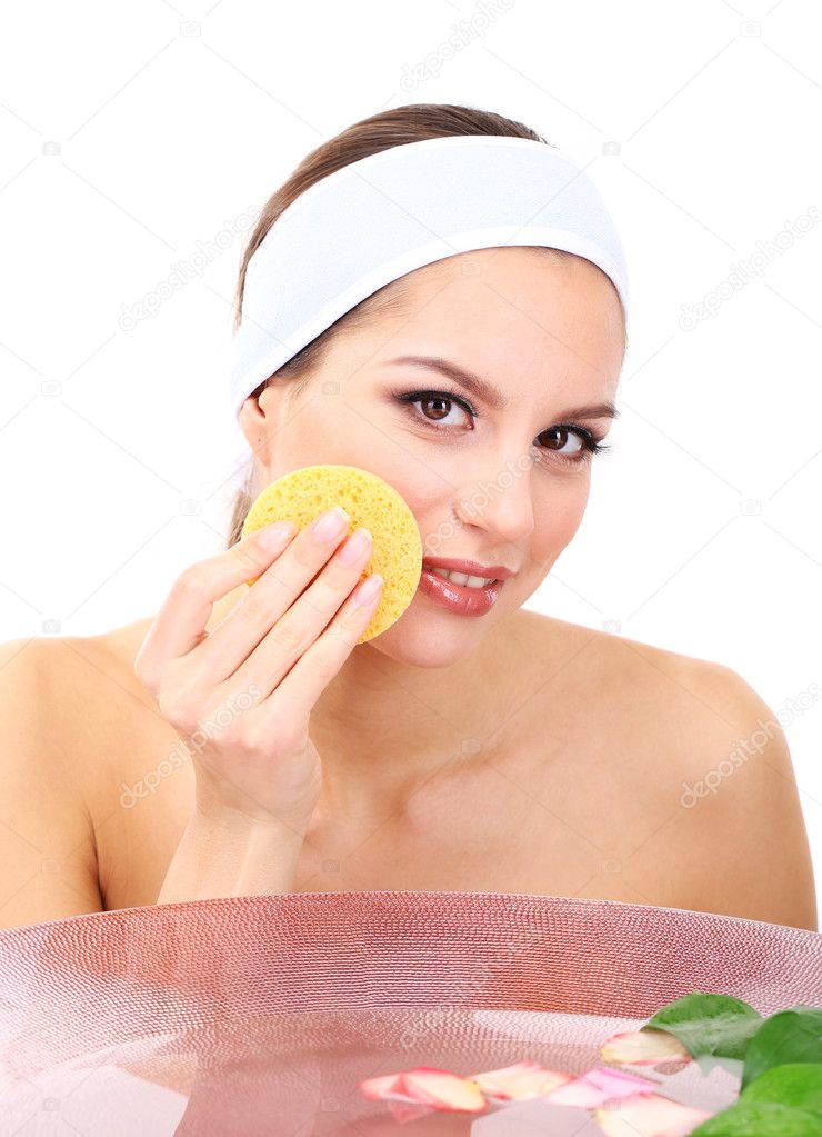 Young woman washing her face. Conceptual photo: make-up remover