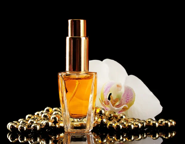 Vrouw perfume in mooie fles en orchideebloemen, op zwarte achtergrond — Stockfoto