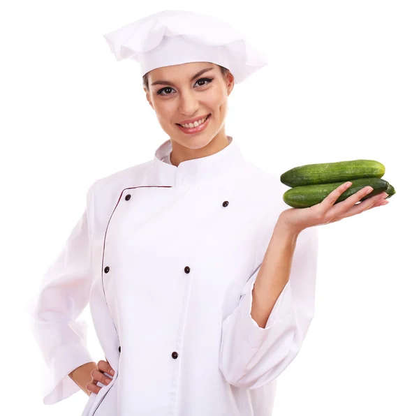 Portret młodej kobiety kucharz z warzywami na białym tle — Zdjęcie stockowe