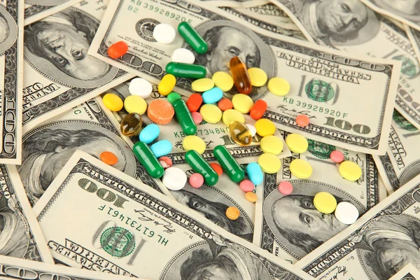 Pills and money close-up background — Stock Photo, Image