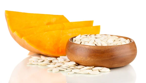 Pumpkin seeds in wooden bowl isolated on the white — Stock Photo, Image