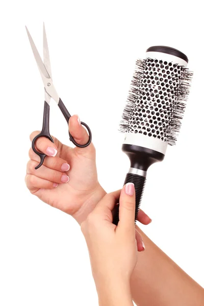 Color comb and scissors in female hand, isolated on white — Stock Photo, Image