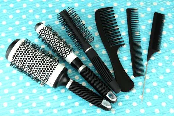 Black combs on color background — Stock Photo, Image