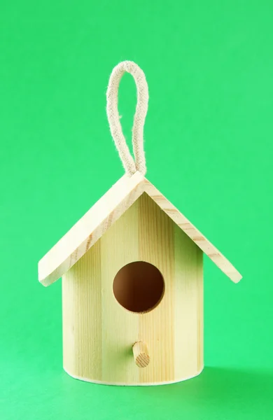 Nesting box on color background — Zdjęcie stockowe