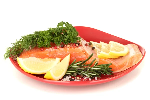 Fresh salmon fillet with herbals and lemon slices on plate, isolated on white — Stock Photo, Image