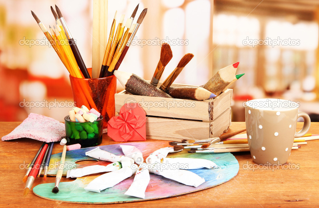 Artistic equipment: paint, brushes and art palette