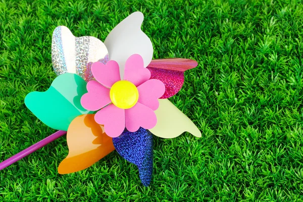 Colored pinwheel on grass — Stock Photo, Image