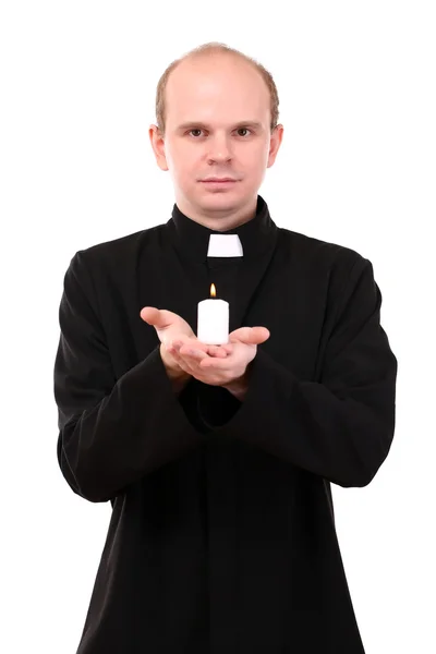 Portrait of young Pastor holding candle in his hand, isolated on white — Stock Photo, Image