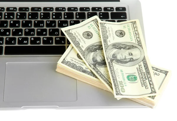 Pieniądze na laptopa na białym tle — Zdjęcie stockowe