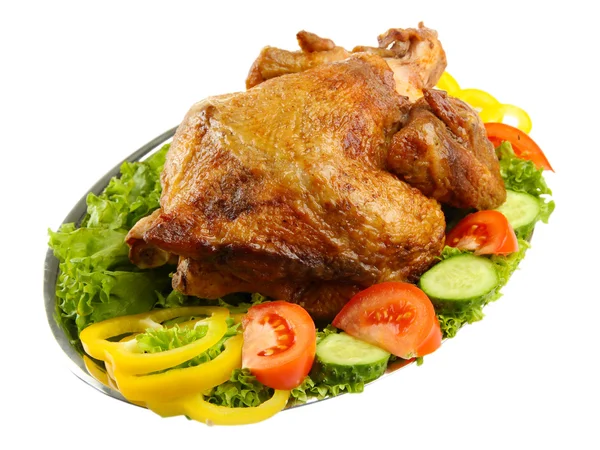 Tasty whole roasted chicken on plate with vegetables, isolated on white — Stock Photo, Image