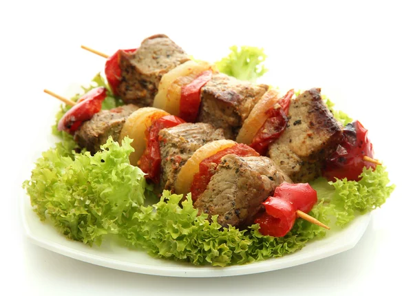 Tasty grilled meat and vegetables on skewers on plate, isoalted on white — Stock Photo, Image