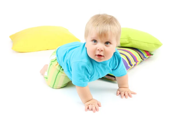 Pequeño niño y almohadas de color, aislado en blanco —  Fotos de Stock