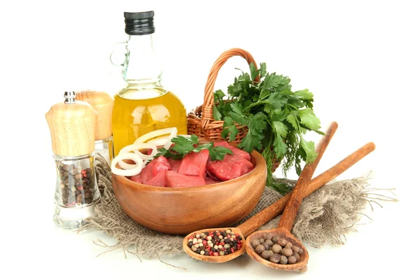 Raw beef meat in bowl with herbs, spices and cooking oil isolated on white — Stock Photo, Image