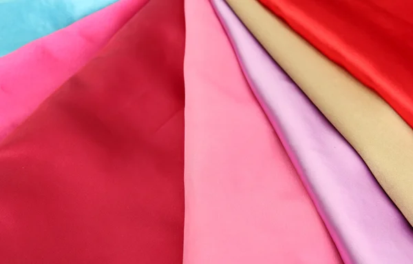 Heap of cloth fabrics, close up — Stock Photo, Image