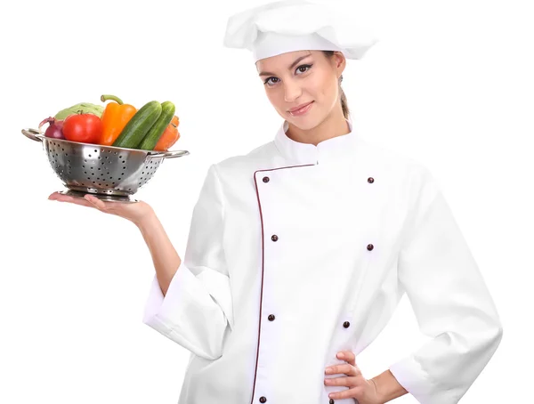 Портрет молодої жінки шеф-кухаря з овочами ізольовані на білому — стокове фото