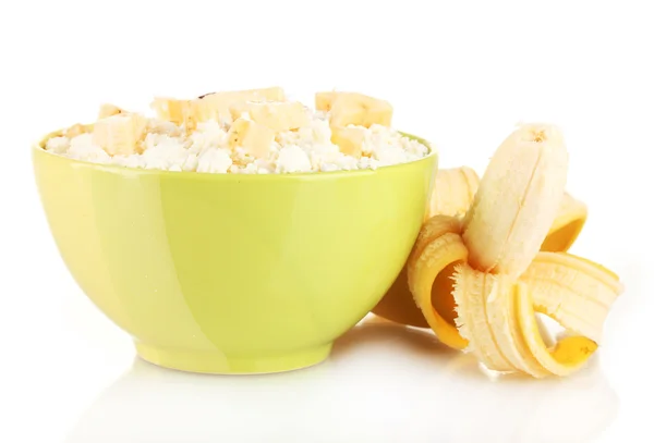 Cottage cheese in color bowl with banana, isolated on white — Stock Photo, Image