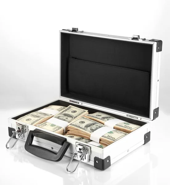 Suitcase with 100 dollar bills isolated on white — Stock Photo, Image