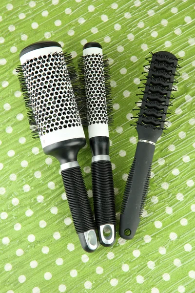 Black combs on color background — Stock Photo, Image