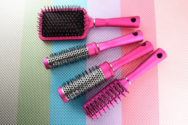 Comb brushes on bright background — Zdjęcie stockowe