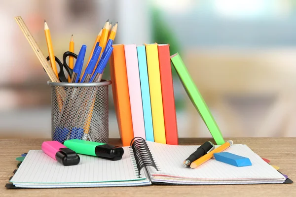 School supplies and books on wooden table — Stock Photo, Image