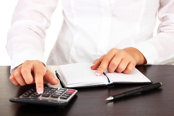 Woman's hands counts on the calculator, close-up — Stock Photo, Image