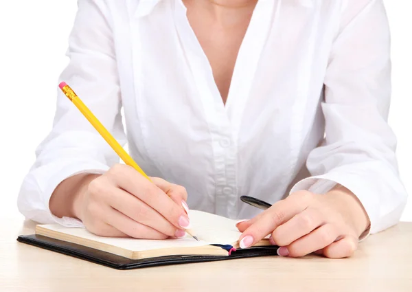 Primer plano de las manos de la mujer de negocios, la escritura en papel — Foto de Stock