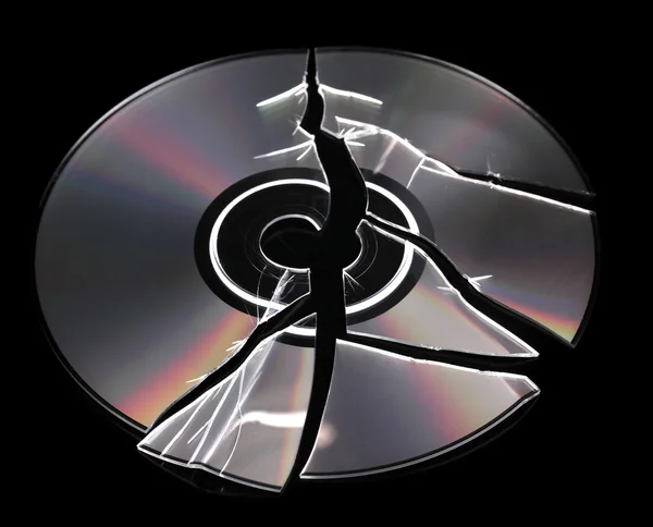 Broken disk with information isolated on black — Stock Photo, Image