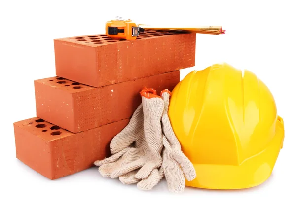 Helmet, roulette, bricks and gloves isolated on white — Stock Photo, Image