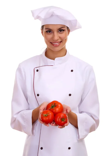 Porträt einer jungen Köchin mit Gemüse auf weißem Hintergrund — Stockfoto