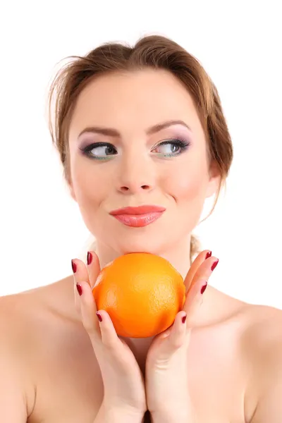 Beautiful young woman with bright make-up, holding orange, isolated on white — Stock Photo, Image