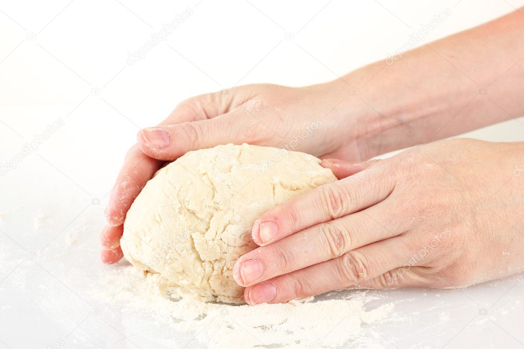 Preparing pizza dough isolated on white