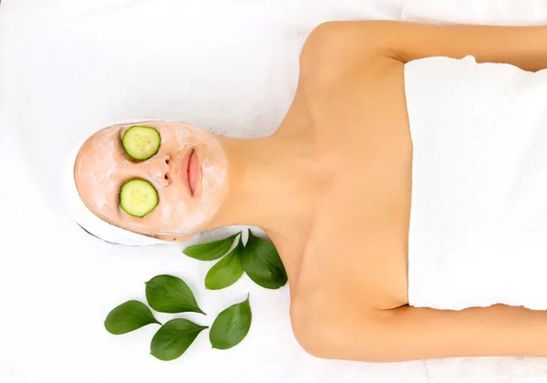 Young woman with creamy facial mask — Stock Photo, Image