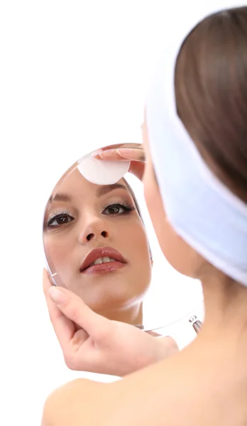 Young woman cleansing her face, isolated on white — Stock Photo, Image