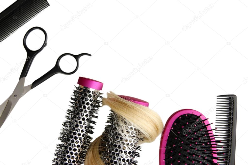 Comb brushes, hair and cutting shears, isolated on white