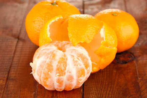 Tasty mandarines on wooden background — Stock Photo, Image