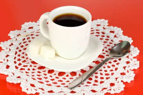 A cup of strong coffee on red background — Stock Photo, Image