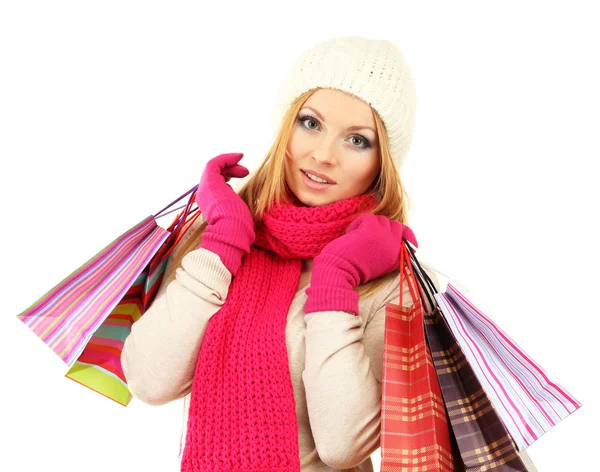 Mujer joven atractiva con muchas bolsas de compras, aislada en blanco —  Fotos de Stock