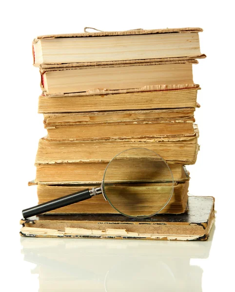 Magnifying glass and books isolated on white — Stock Photo, Image