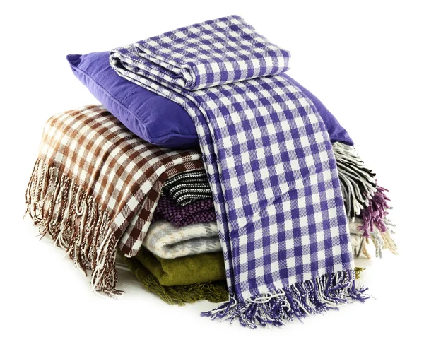 Warm plaids and colorful pillows isolated on white — Stock Photo, Image